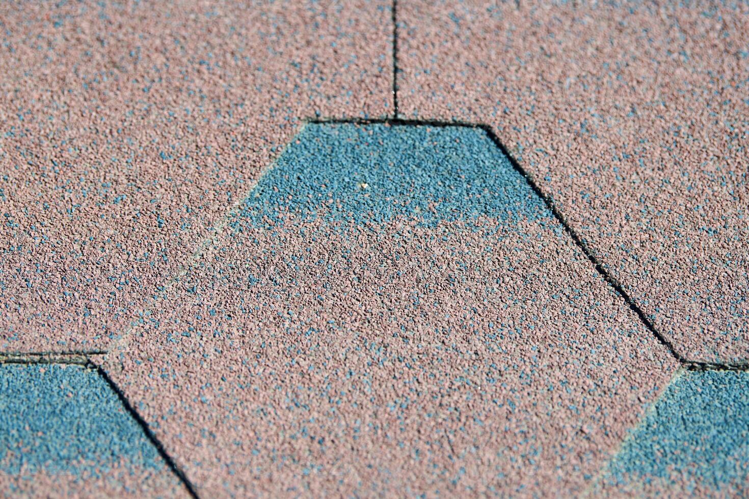 Modern roof shingles tiles, close up. Soft asphalt roof cover. New roofing construction. Easy roofing repair. photo