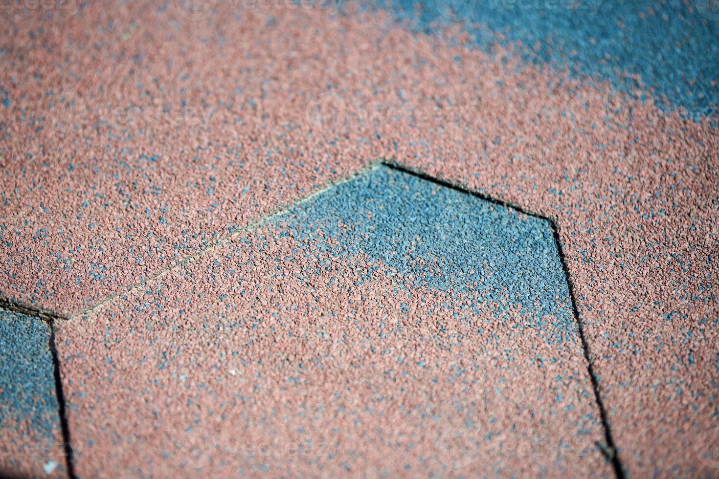 Modern roof shingles tiles, close up. Soft asphalt roof cover. New roofing construction. Easy roofing repair. photo