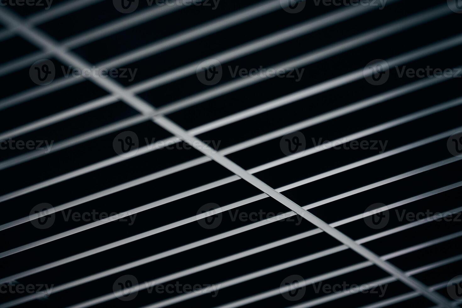 Office grille ceiling. Modern black metal grille ceiling, suspended covering. Abstract design texture. photo