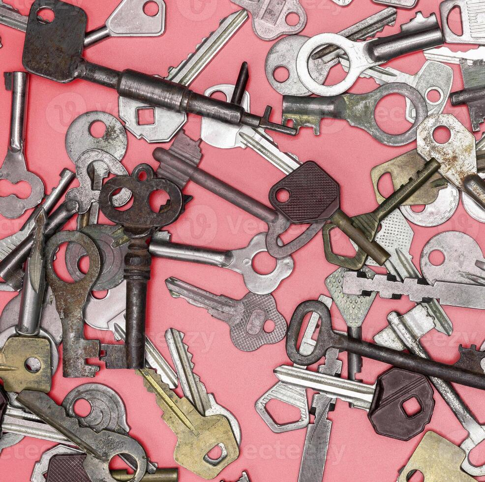 Keys set on pink background. Door lock keys and safes for proper photo