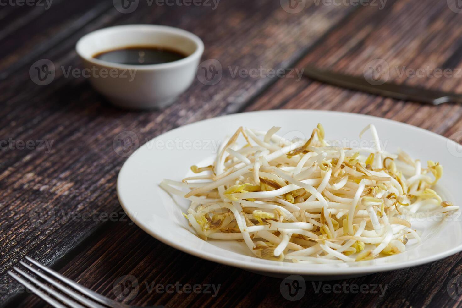 Bean sprouts of mung, maash. Traditional vegan dish in east Asia. Healthy diet food. photo