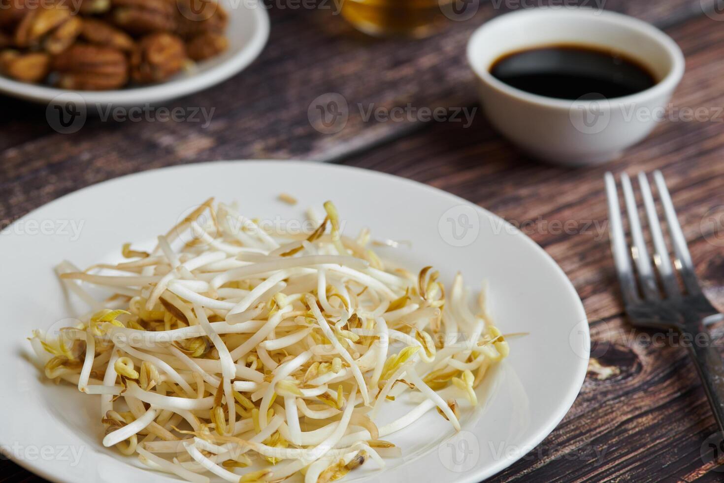 Bean sprouts of mung, maash. Traditional vegan dish in east Asia. Healthy diet food. photo