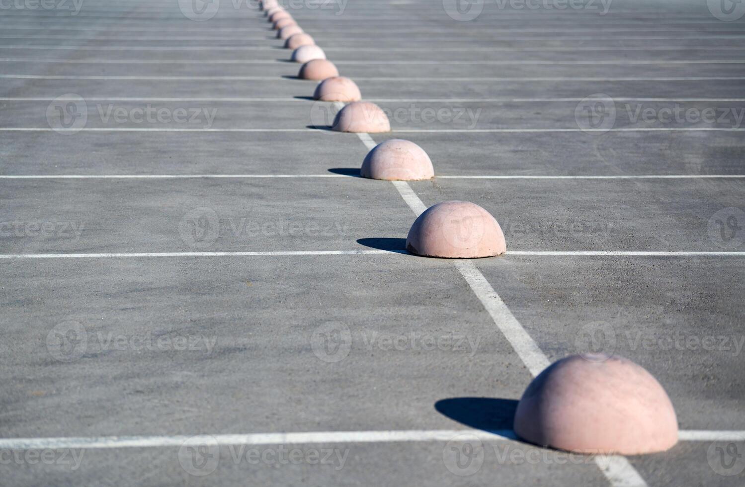 Parking hemispheres. Concrete parking limiter. Protection from car parking. Elements to restrict access to parking zone and control movement of vehicles photo