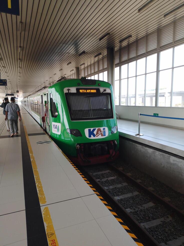 Front view of a train stopped waiting for passengers photo