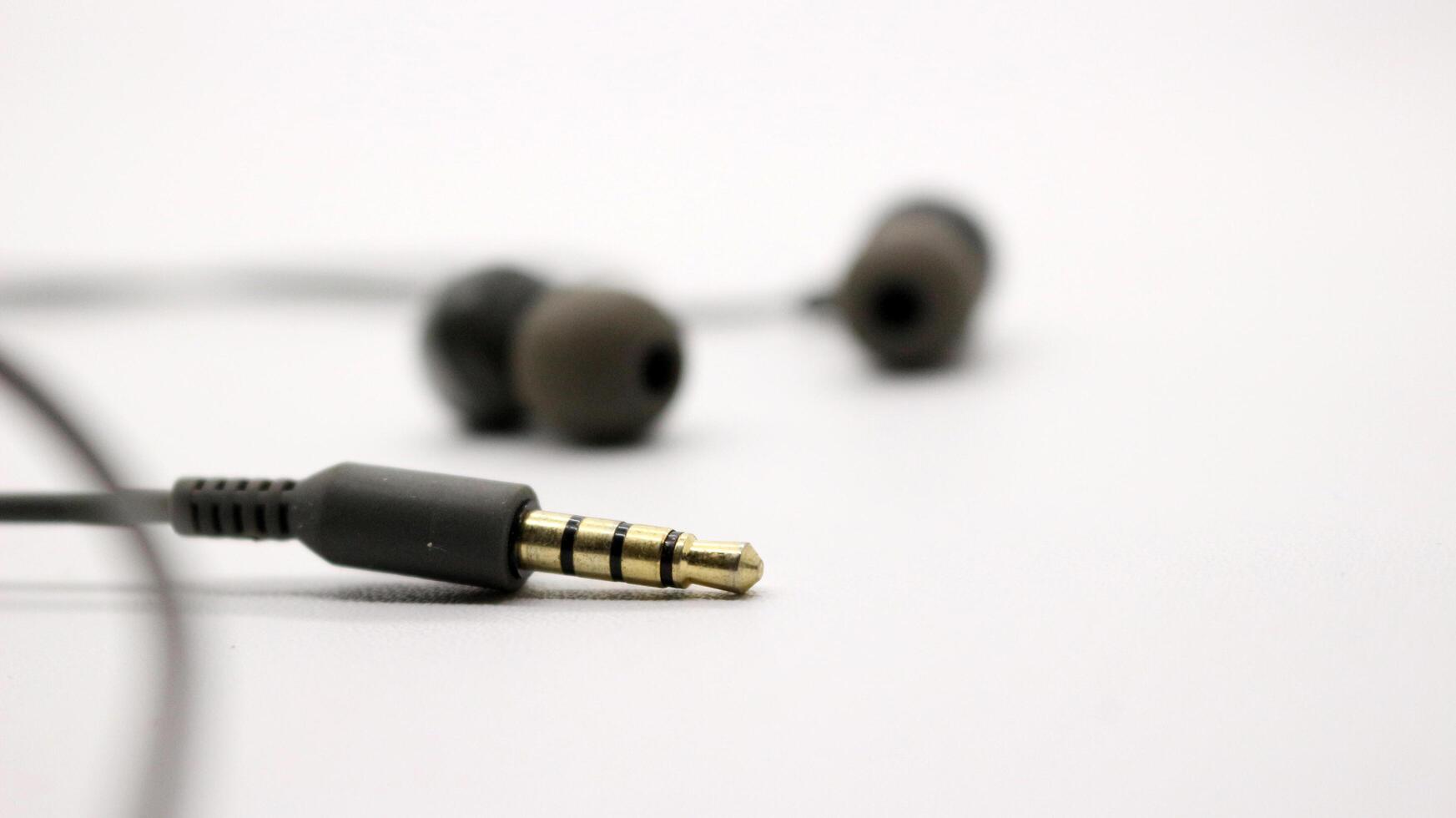 Close up of black wired earphones photo