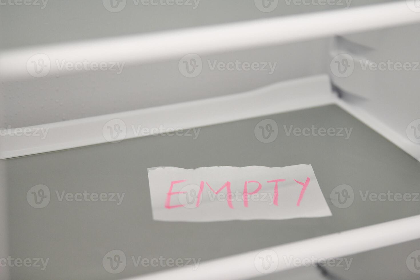Empty refrigerator concept. Empty shelves of new refrigerator. Weight loss diet concept. photo