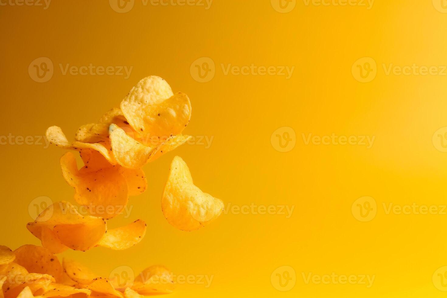 AI generated Potato chips close-up on a yellow background, levitation, flight photo