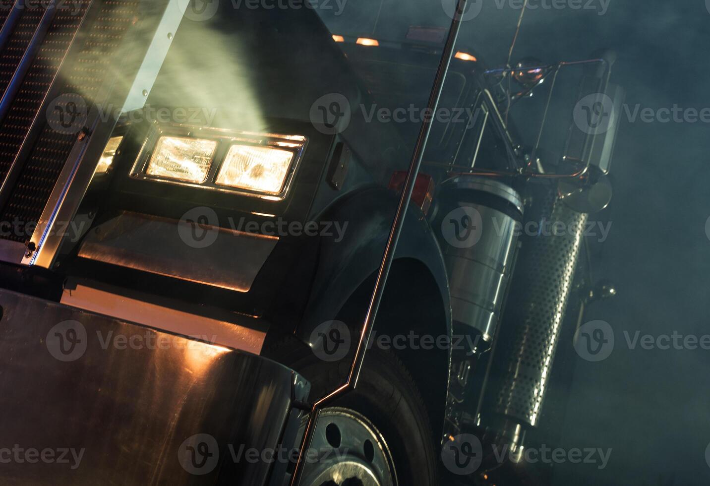 Semi Truck on a Foggy Road During Night Drive photo