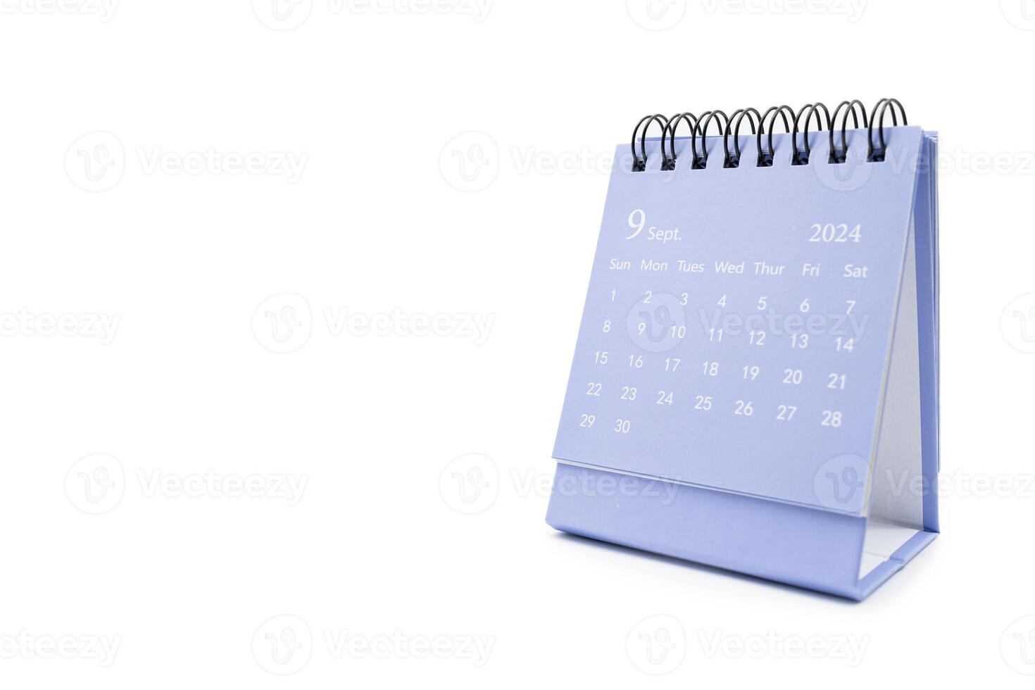 Simple desk calendar for September 2024 isolated on white background. Calendar concept with copy space. photo