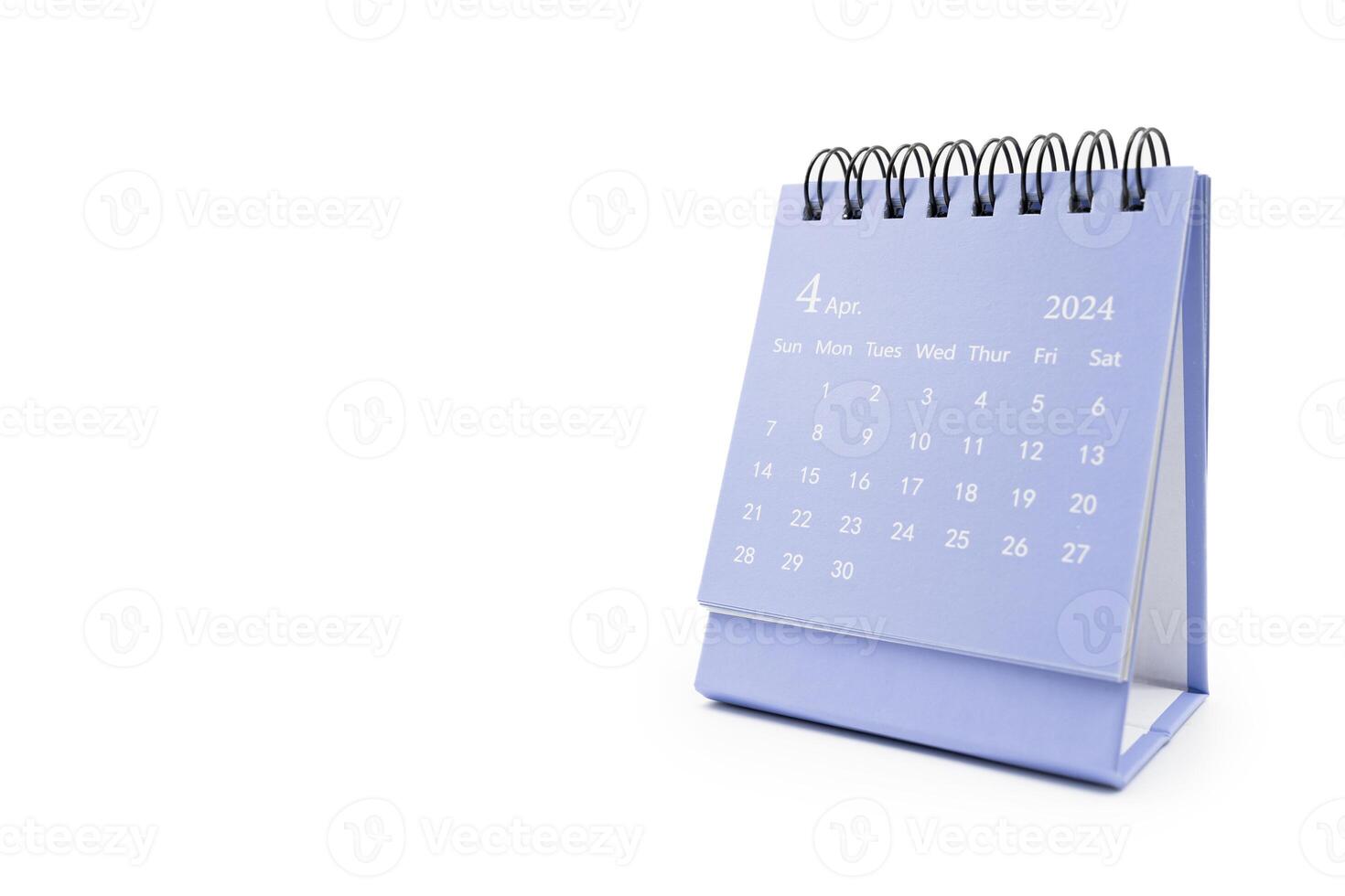 Simple desk calendar for April 2024 isolated on white background. Calendar concept with copy space. photo