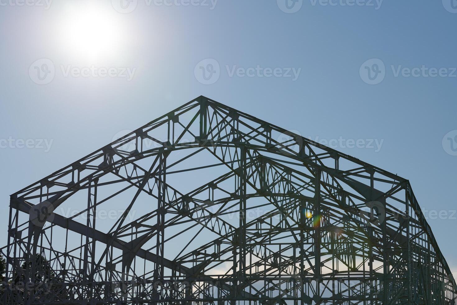 Steel frame of warehouse for goods. Metal construction of railway building. photo