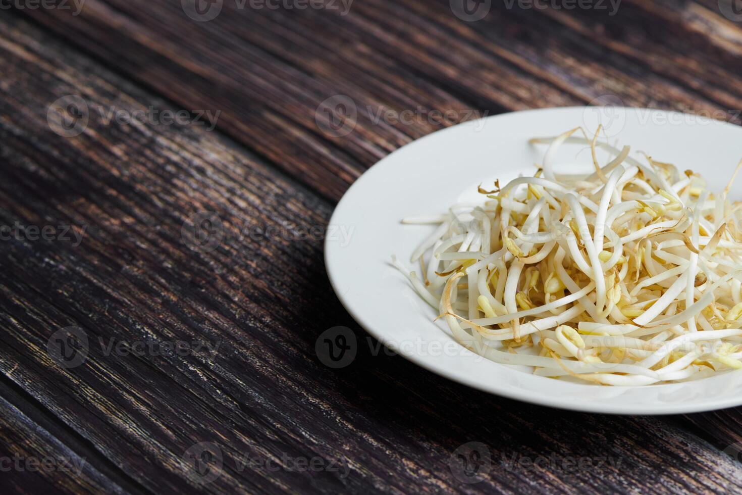 Bean sprouts of mung, maash. Traditional vegan dish in east Asia. Healthy diet food. photo