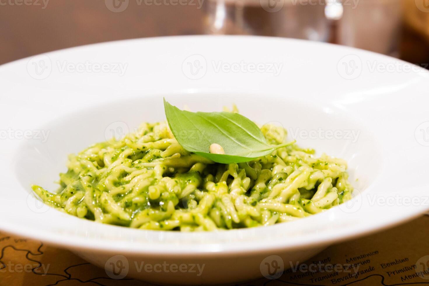 Traditional Italian food - trofie al pesto, typical regional pasta from Liguria region, basil sauce photo