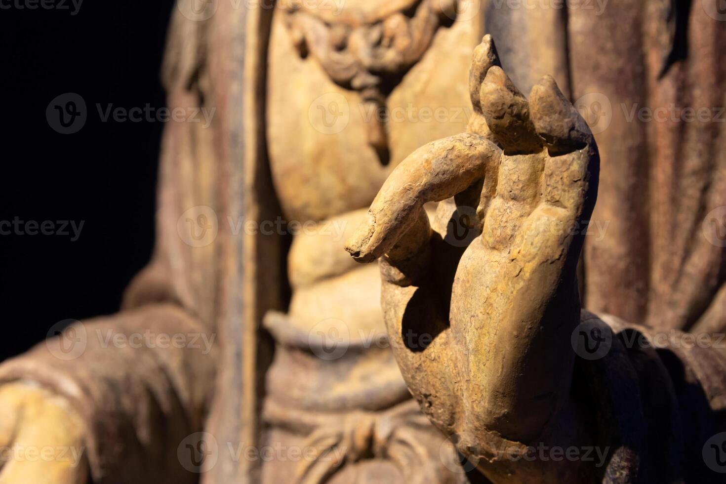 Ancient Buddha hand. Concept of energy, ethnic, harmony, meditation, peace. photo