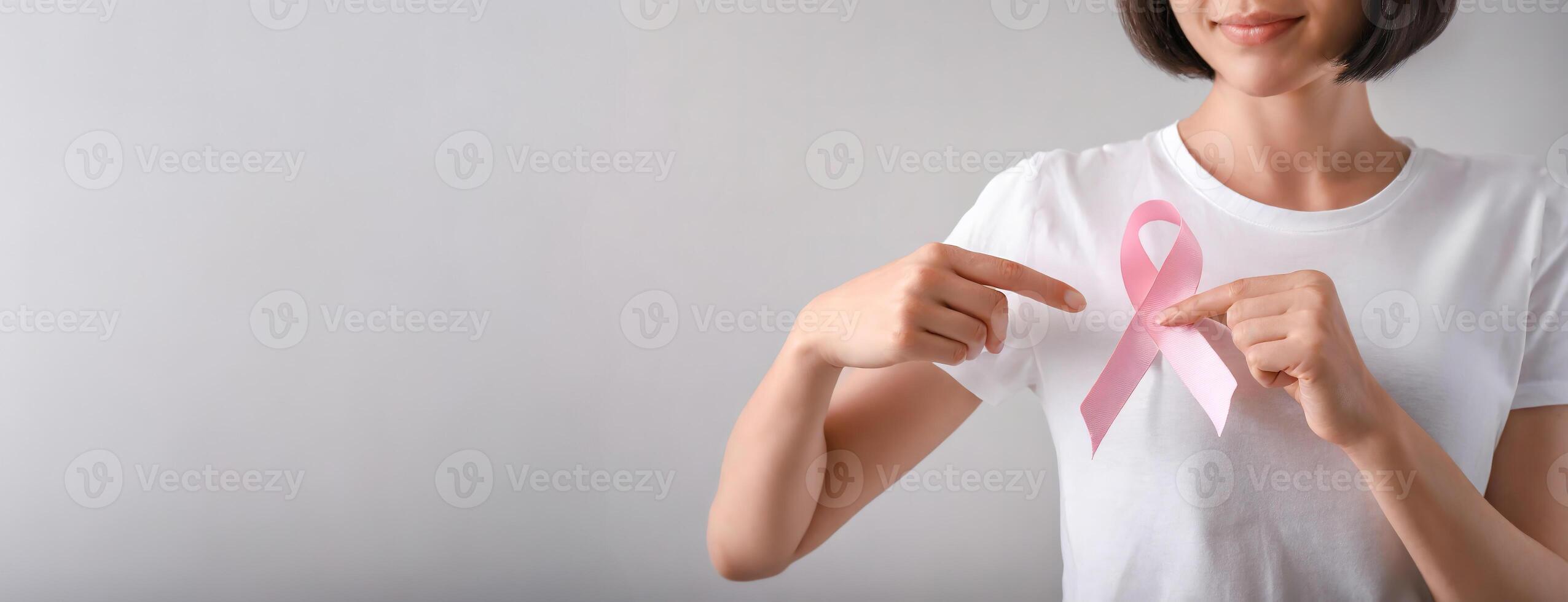 AI Generated Woman Supporting Breast Cancer Awareness with Pink Ribbon photo