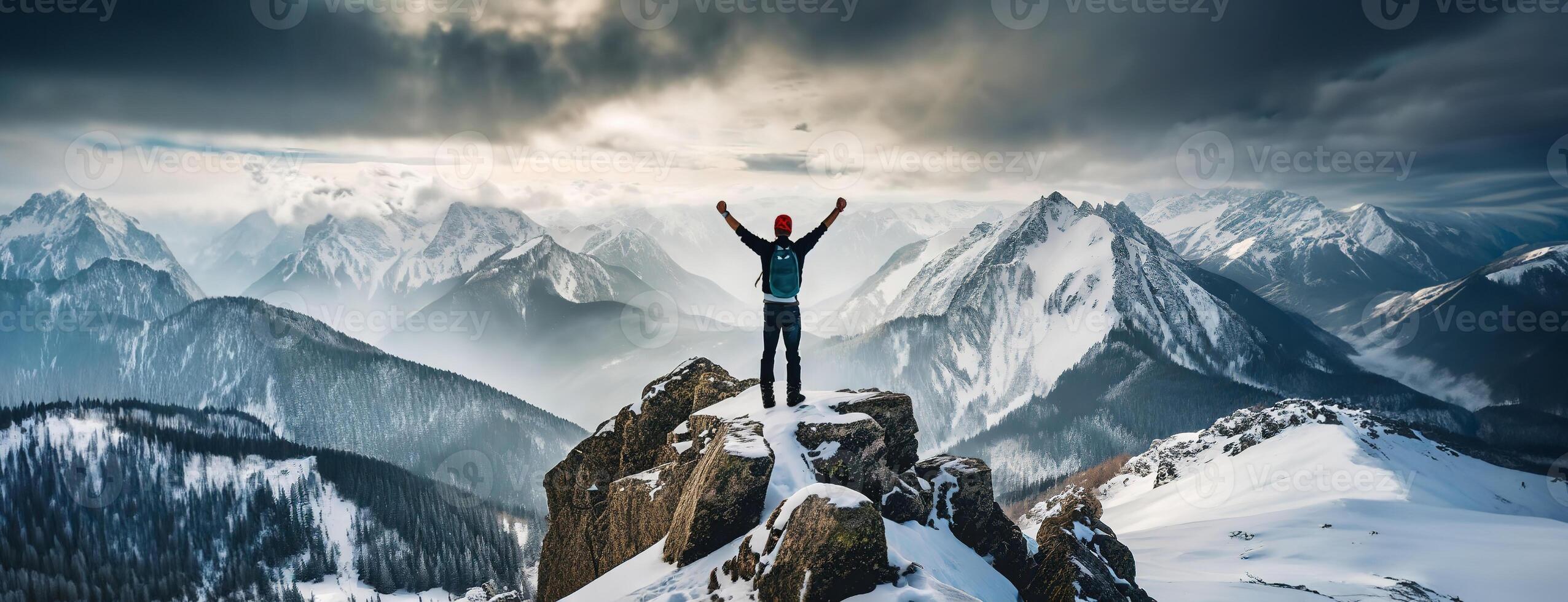 AI Generated Climber alpinist at the top of a snowy mountain in winter. Cliff covered with ice, man hiker standing at the peak of rock and celebrates the success. Mountaineer reaching the summit. photo