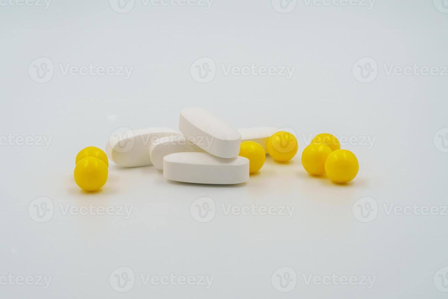 Yellow vitamin capsules, Medicinal pills, tablets, pharmaceutical healthcare products, drugs for medical treatment, therapeutic medication, dietary supplements, pharmacological, health aid photo