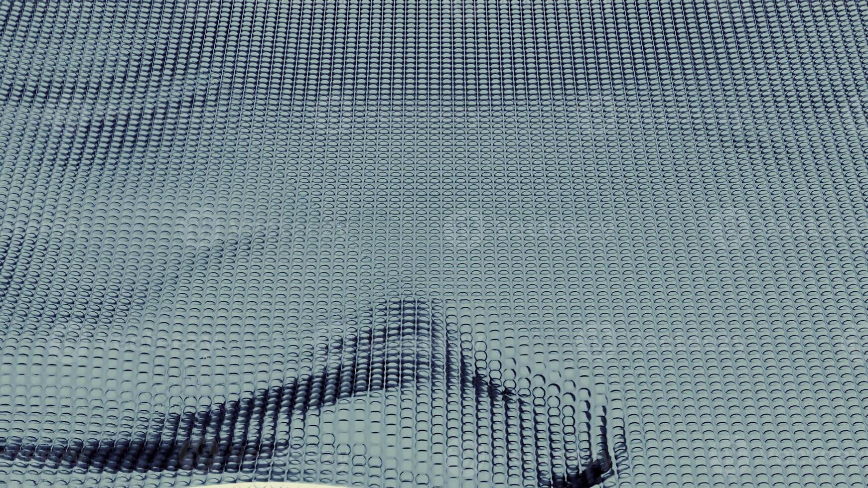minimalista vistoso ondulación antecedentes. diseño. geométrico movimiento modelo con ondulado superficie de muchos filas de partículas foto
