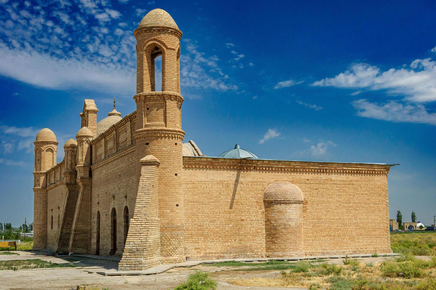 Brick domes and arched entryways define the Arystanbab Mausoleum, the teacher of Khoja Ahmed Yasawi, now a museum preserving the legacy of the mystic and preacher. Islamic, Muslims photo