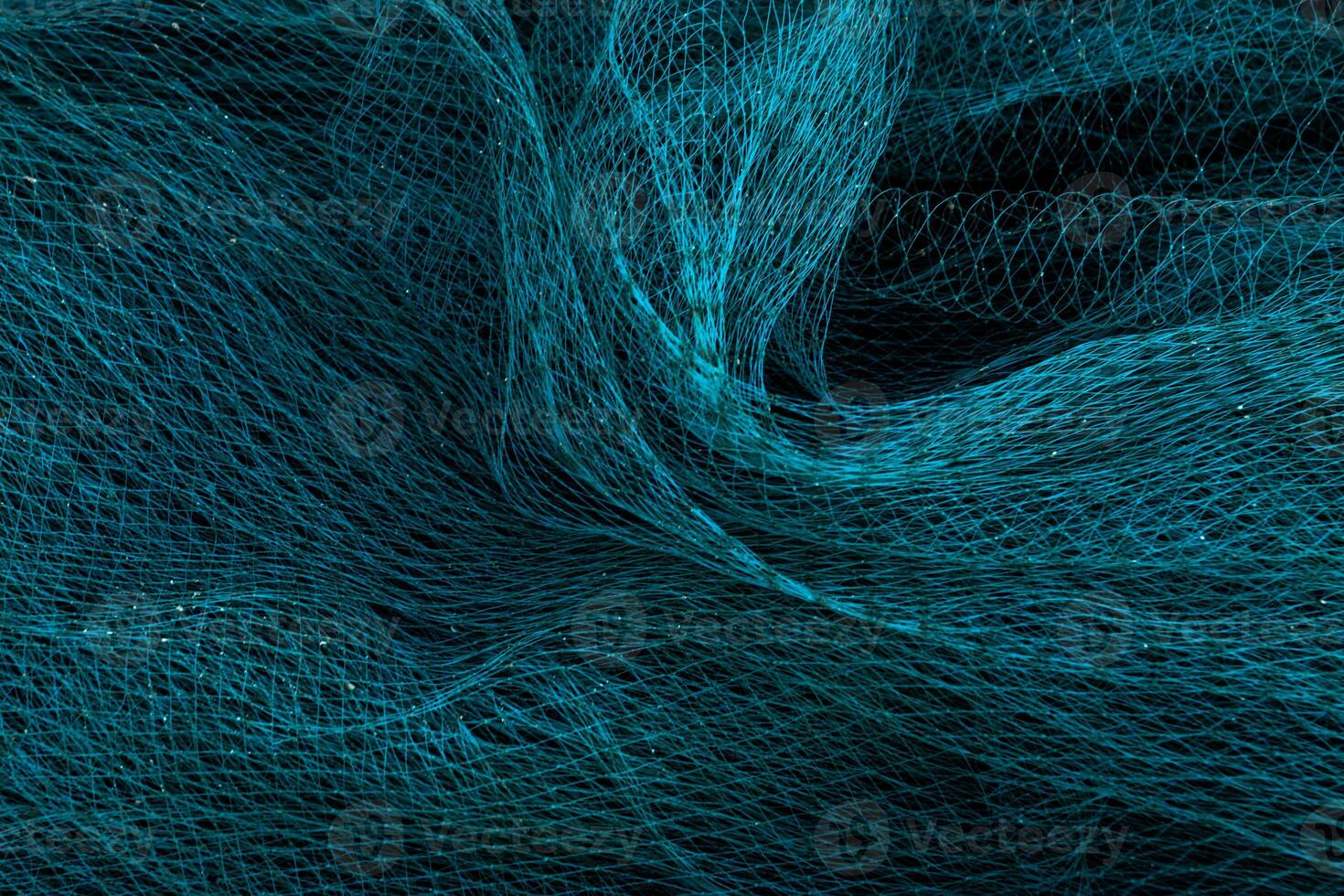 Blue nets background in the dark. photo