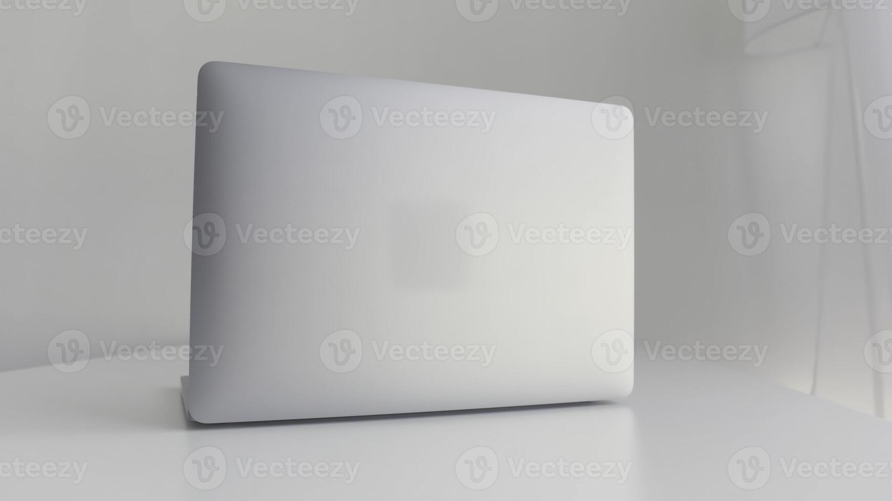 Rear view of a white laptop isolated on white background. Action. Modern slim design of a new laptop made of aluminum material on white table, concept of modern technologies. photo