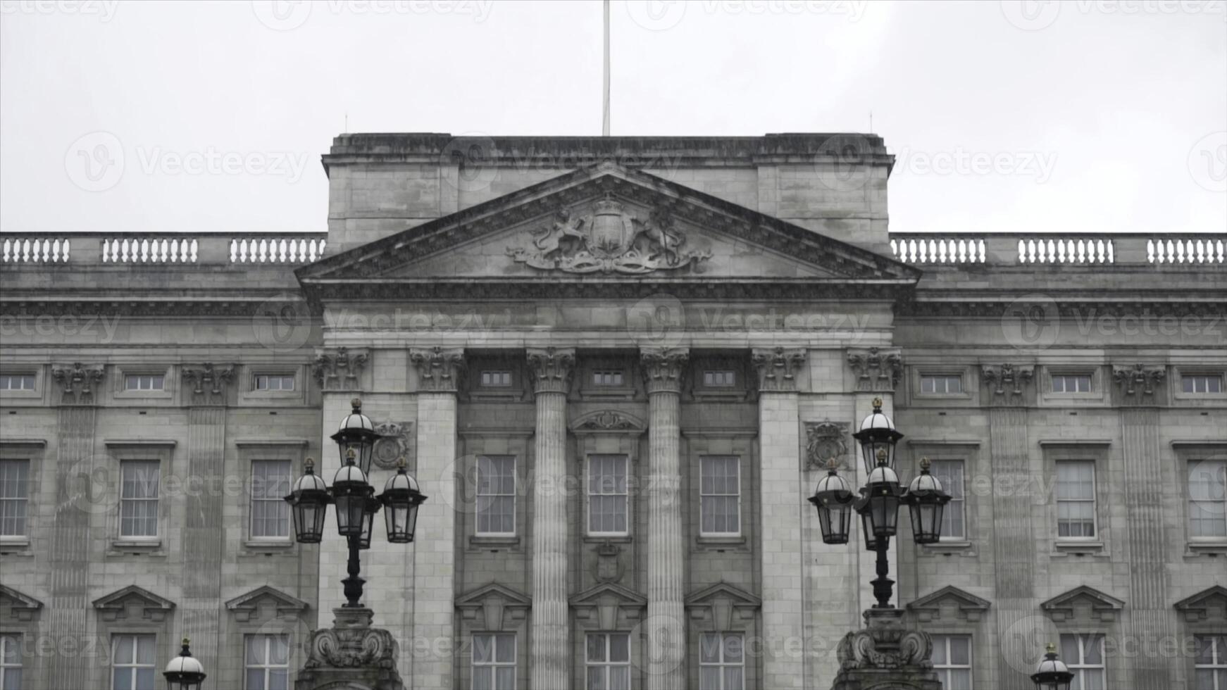 Close-up view of the Buckingham Palace exterior in rainy and gloomy autumn day. Acion. British landmarks photo