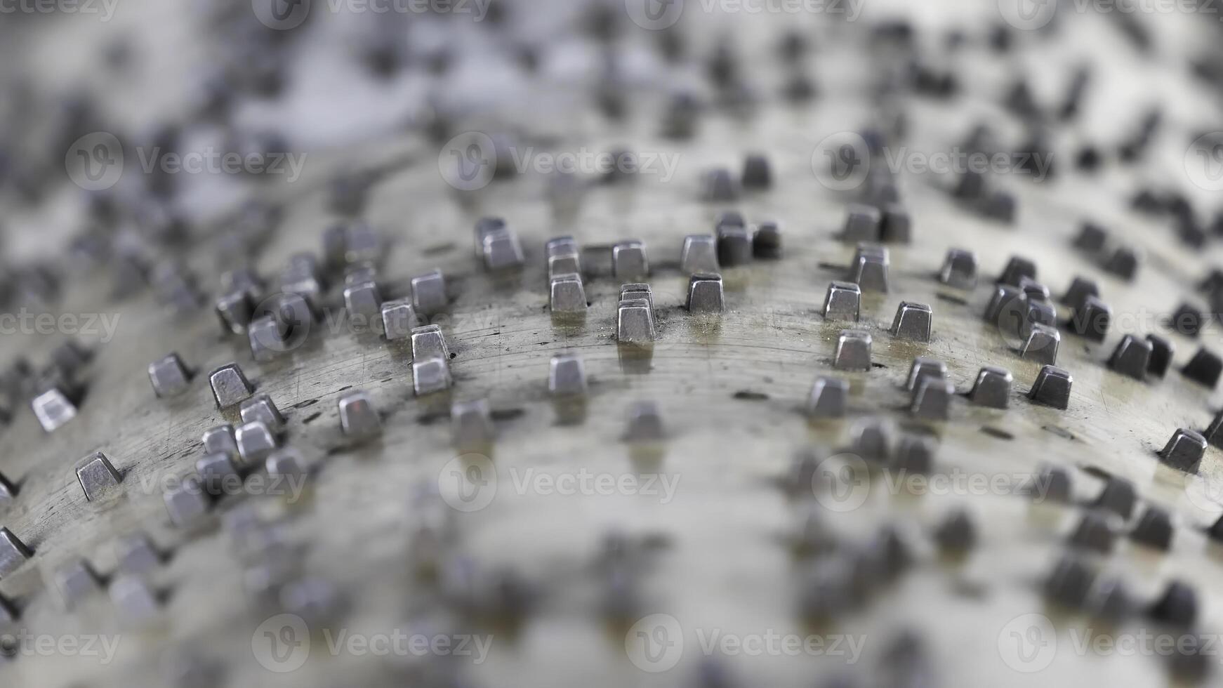 Extreme close up of the spinning mechanism of silver music box. Stock footage. Musical toy in a side view, rotating antique cylinder of a music box photo