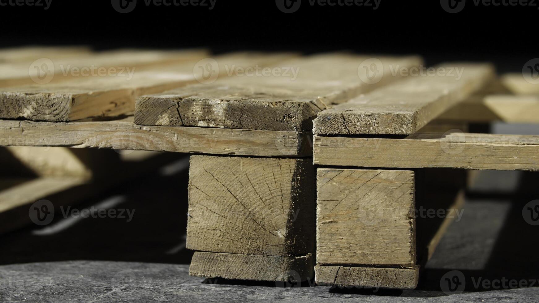 Close-up of wooden pallet. Angle of wooden pallet on grey concrete floor. Production of furniture using pallets photo