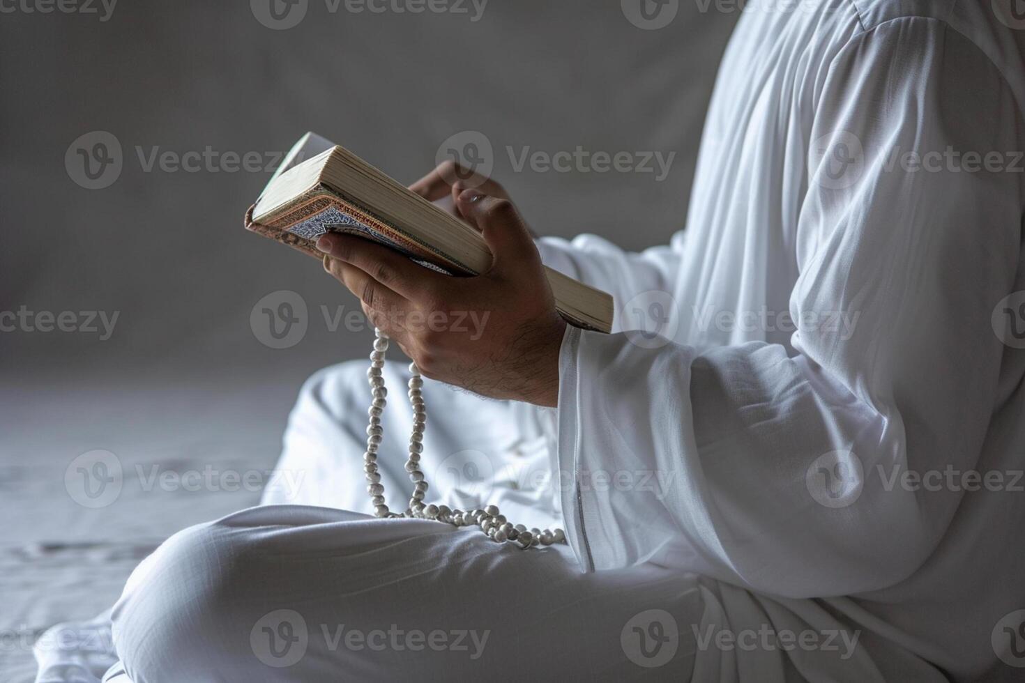 AI generated muslim man praying with quran with generative ai photo