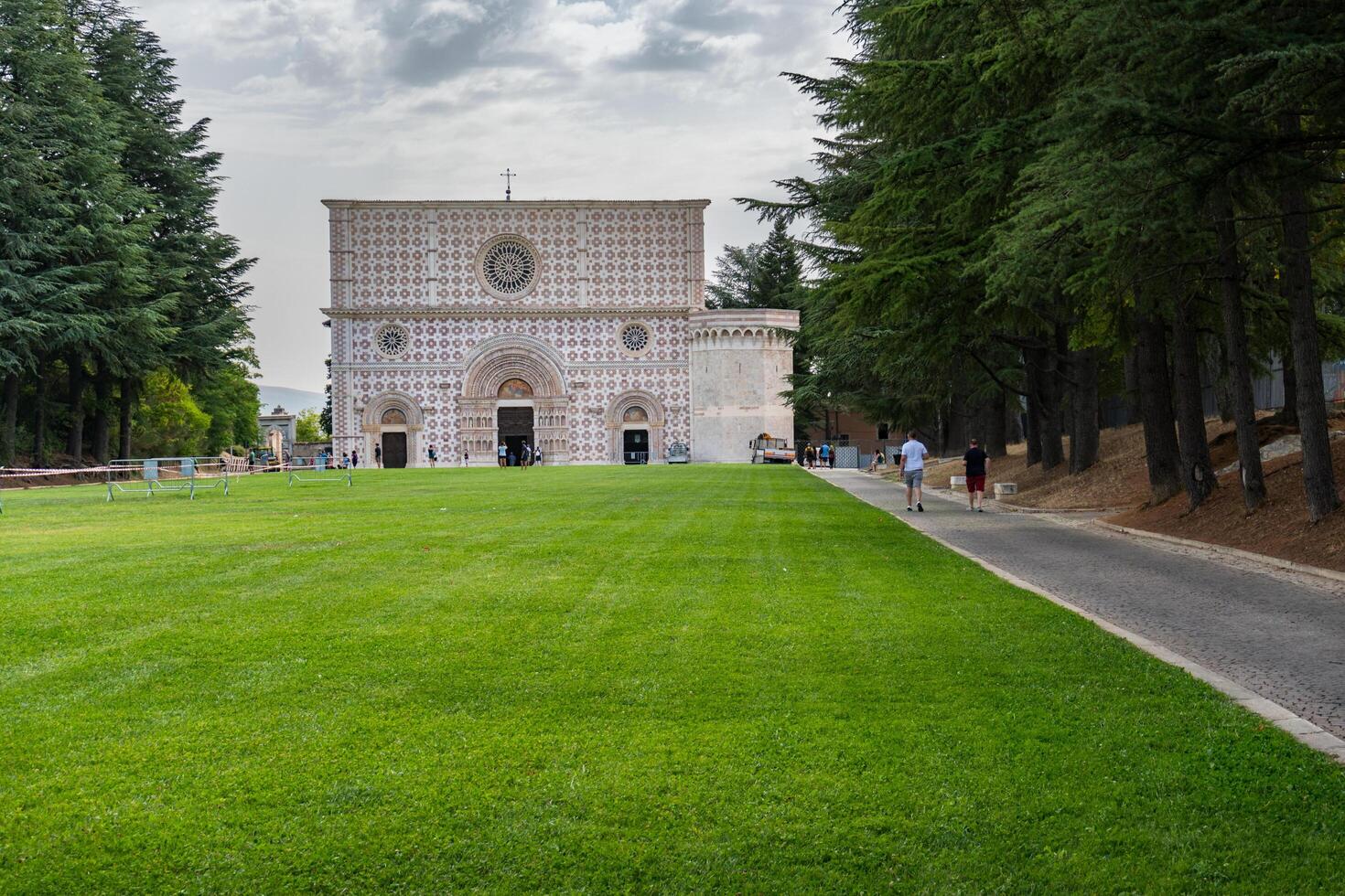 L'Aquila, Italy-august 11, 2021-View of the Basilica of Santa Maria di Collemaggio in L'Aquila during a cloudy day photo