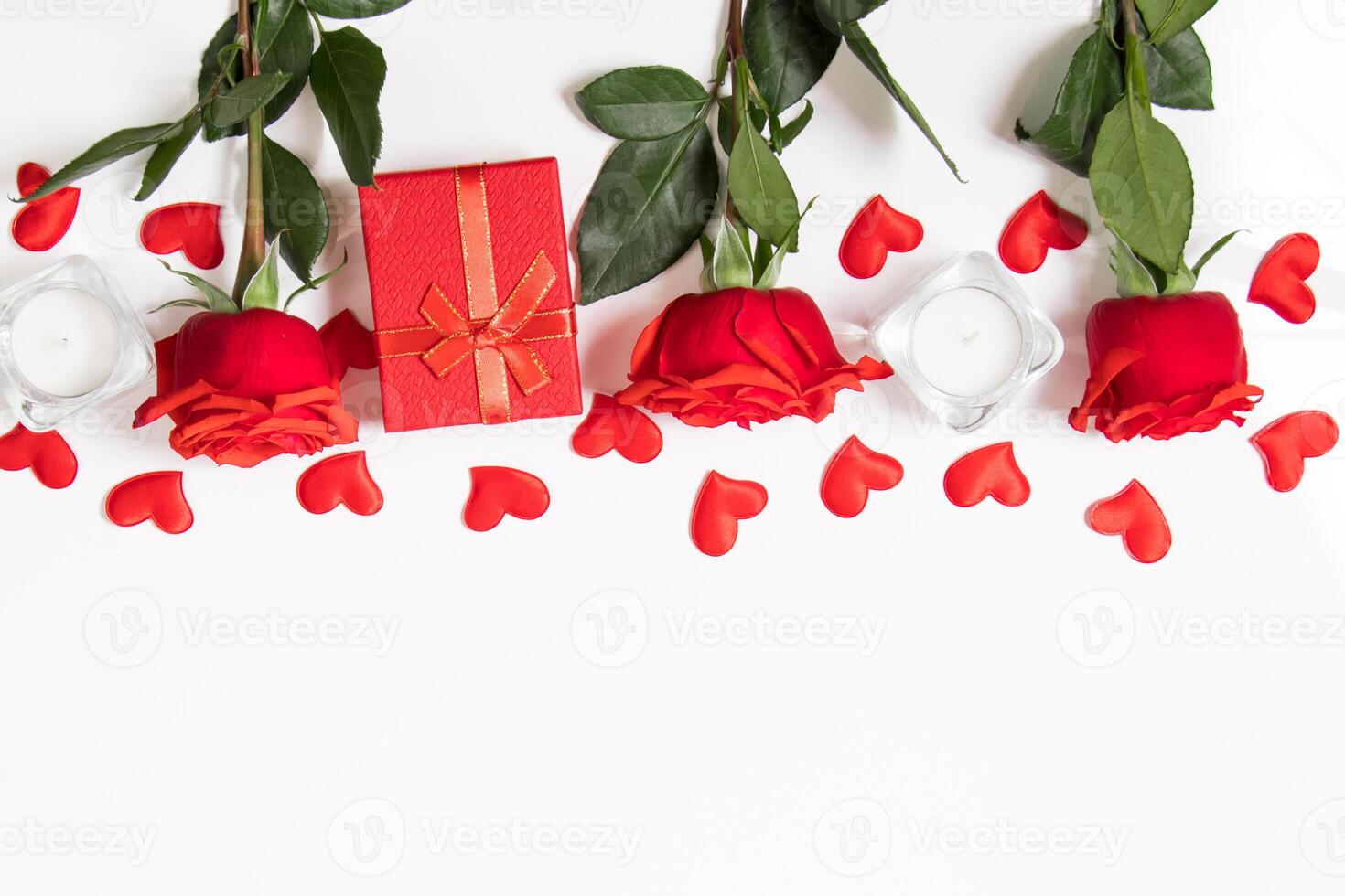 Frame from red hearts and roses on a white background. Valentine's day greeting card. Layout with place for text. photo