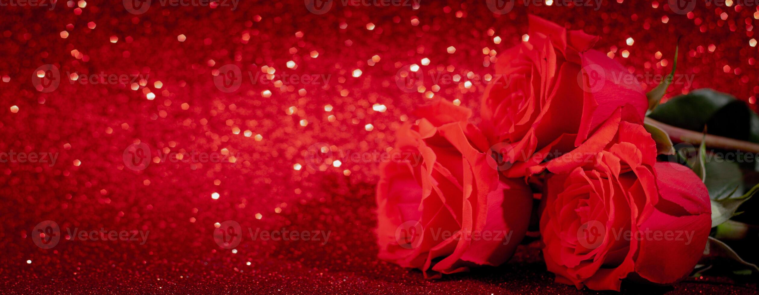 Bouquet of red roses on a shiny bokeh background. Valentine's day concept, place for text. photo