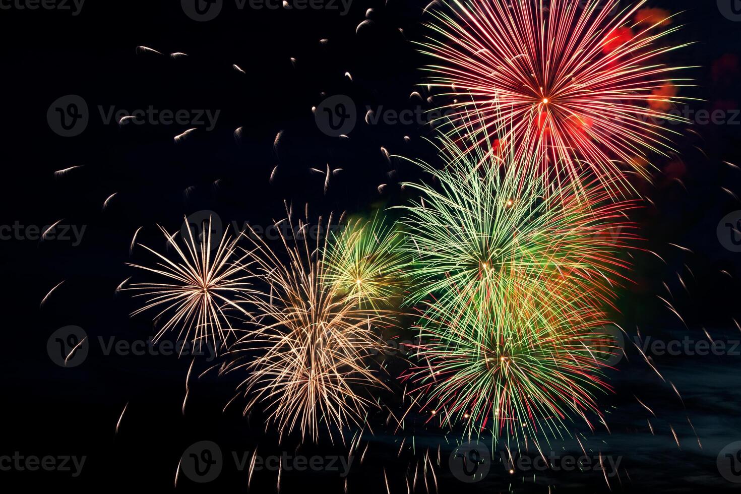 Colorful fireworks on black background. Celebration and holidays concept. Independence Day 4th of July, New Year, festival. Bright explosions of lights in sky. photo