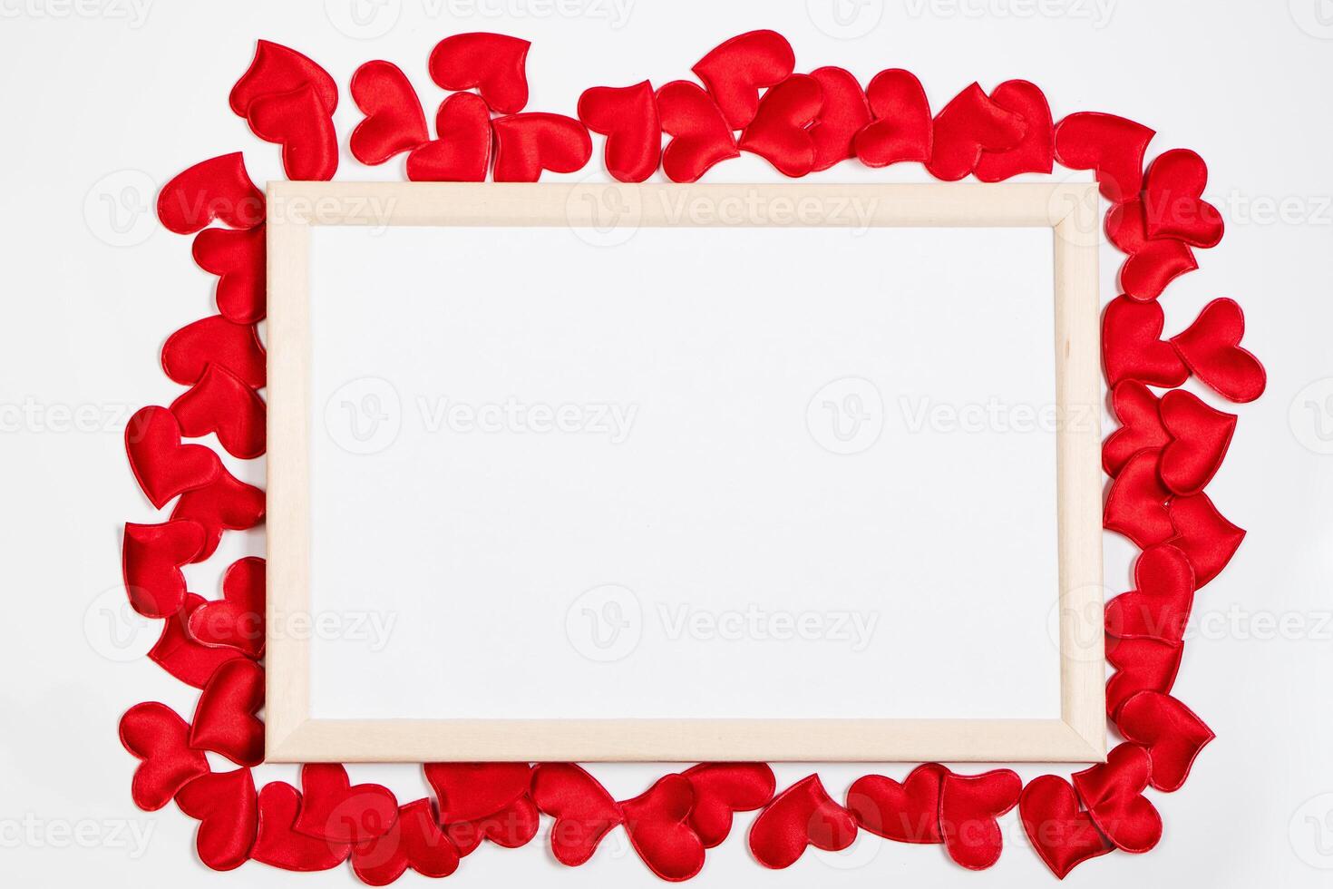 Valentine's day greeting card. Frame from red hearts on a white background. Layout with place for text. photo