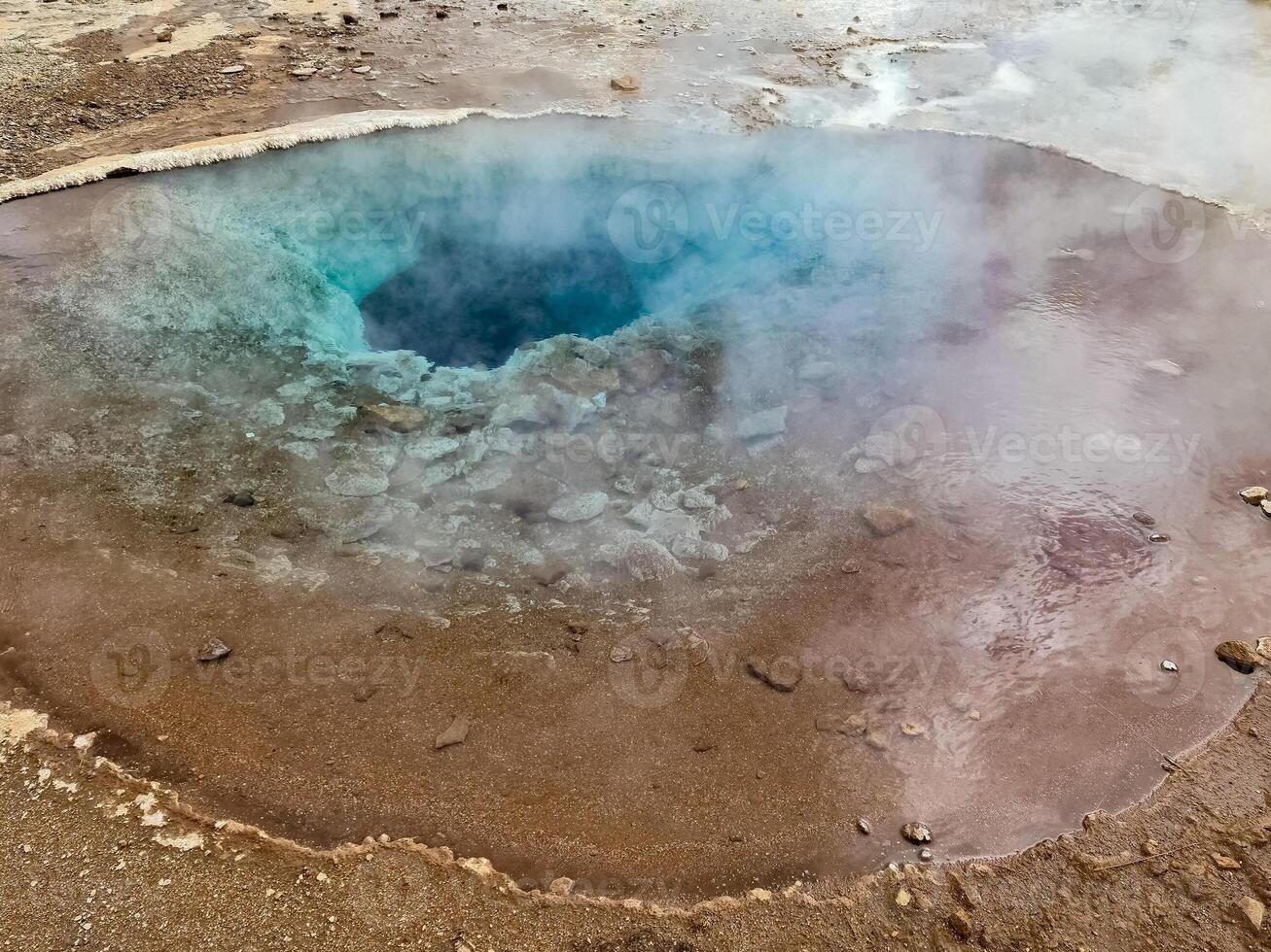 Steaming hot springs on the volcanic sulphur fields of Iceland. photo