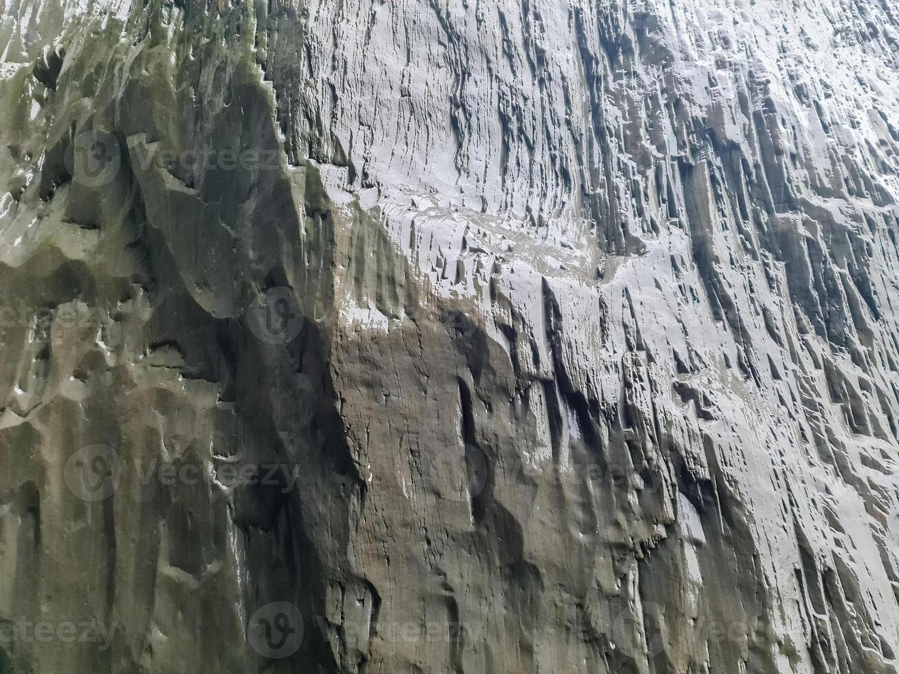 Amazing basalt rock structures at Endless Black Beach of Iceland. photo