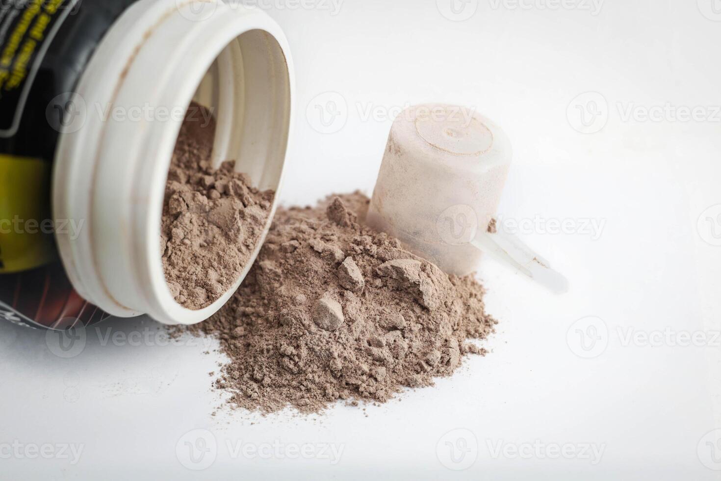 Spoon measure Whey protein chocolate powder for fitness and bodybuilding gaining muscle. photo