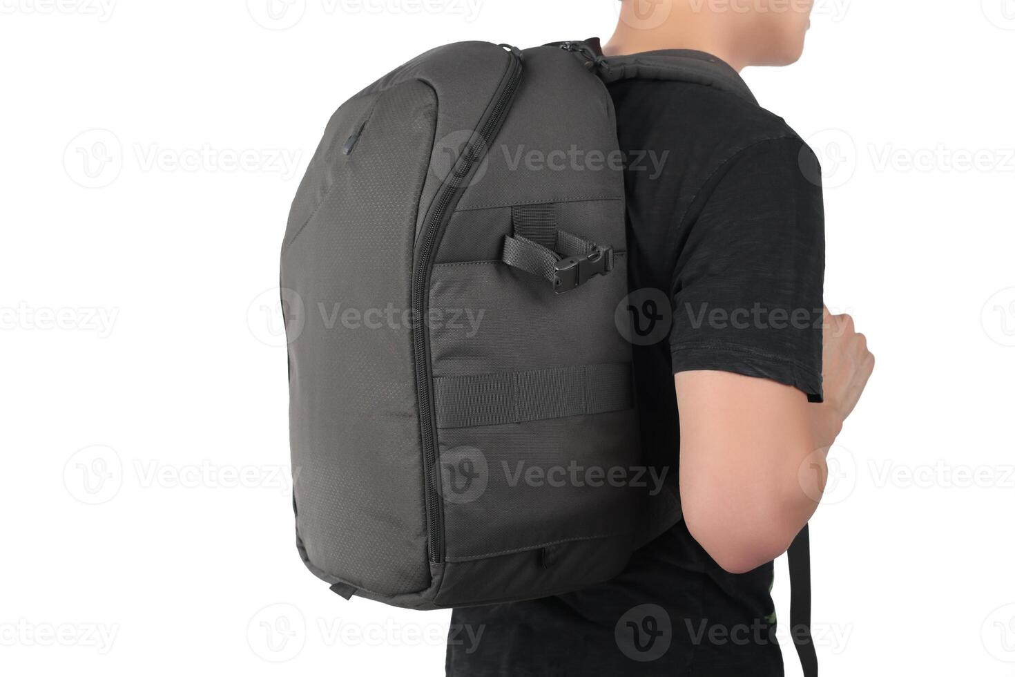 Young man standing with travel backpack equipments isolated white background photo