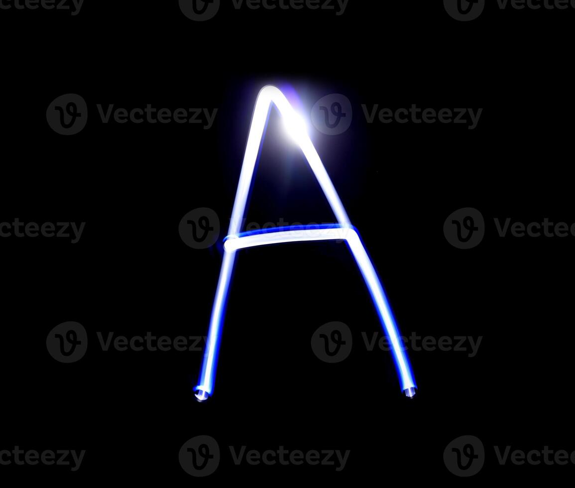 A Able alphabet hand writing blue light  over black background. photo