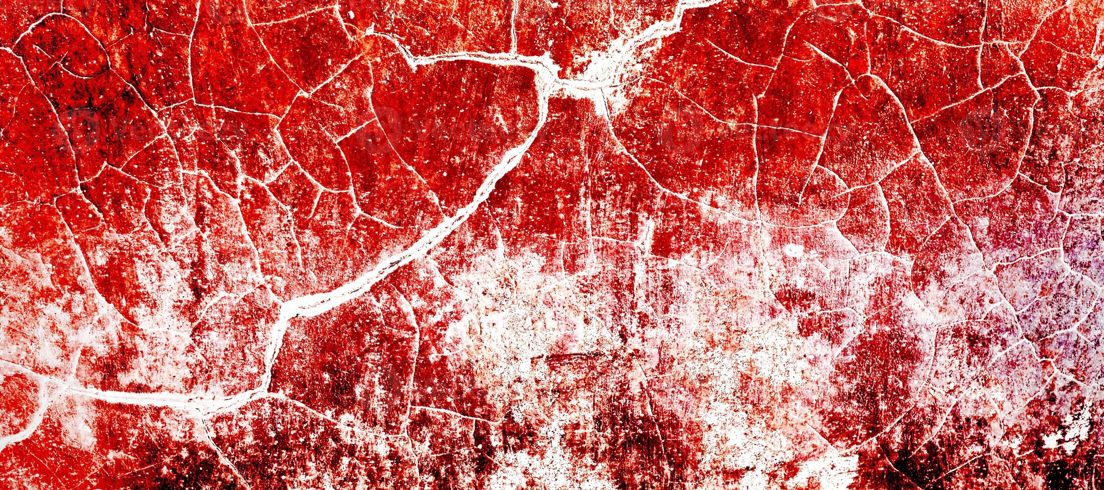 Red dirty wall grunge texture. Abstract scary concrete, Horror cement for background. old concrete wall. Grunge background for design. Distressed, blood, cracked, broken, crumbled photo