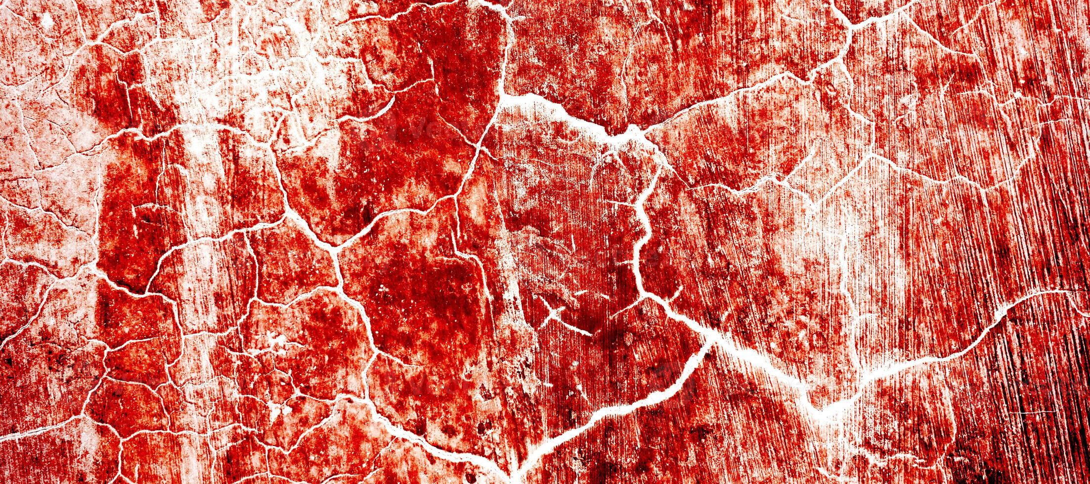 Red dirty wall grunge texture. Abstract scary concrete, Horror cement for background. old concrete wall. Grunge background for design. Distressed, blood, cracked, broken, crumbled photo