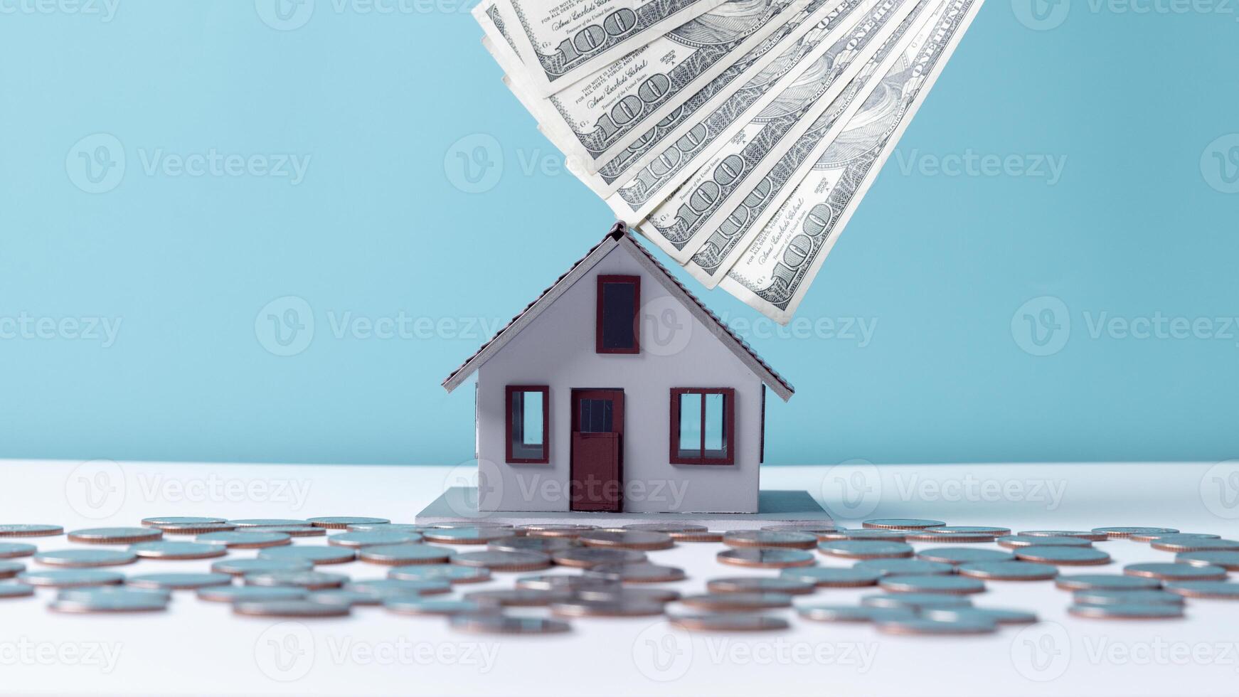 Property tax.investment planning.business real estate. View Of coin stack with house model, mortgage loading real estate property with loan money bank concept.Home sales and home insurance concept. photo