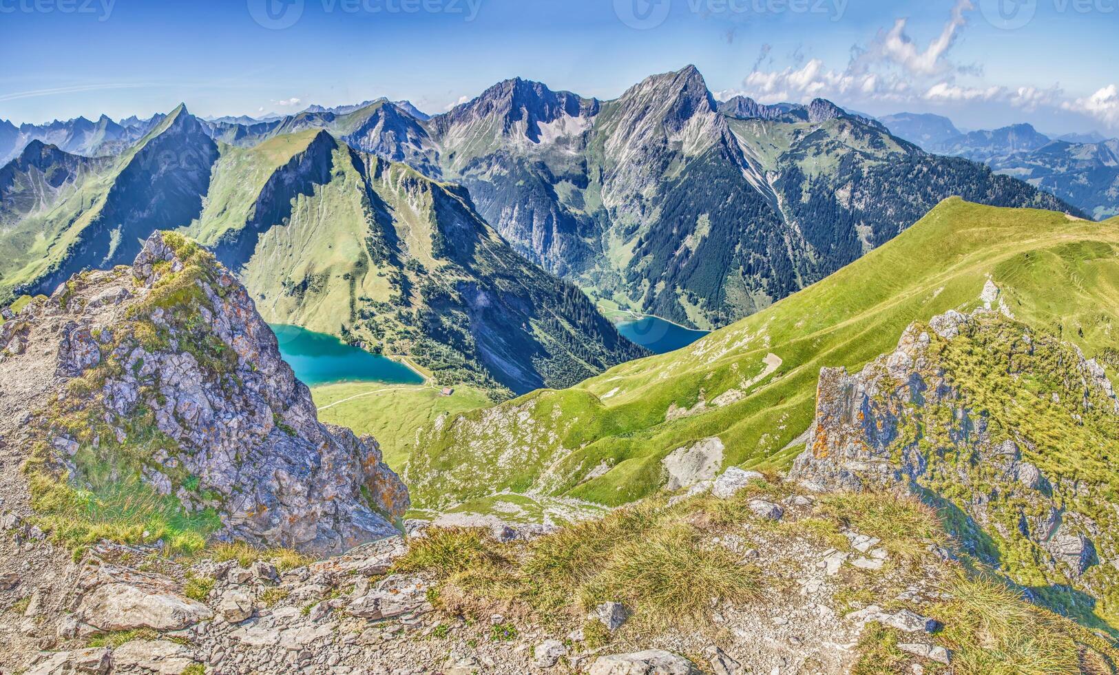Panoramic view over the mountains on the Three Lakes Route in the Tannheimer Valleyi n summer photo