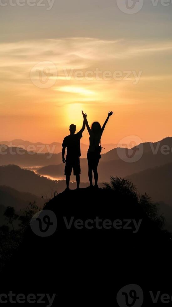 AI Generative Couple traveler on mountain summit enjoying nature view with hands raised over clouds  Sport travel business and success leadership and achievement concept photo