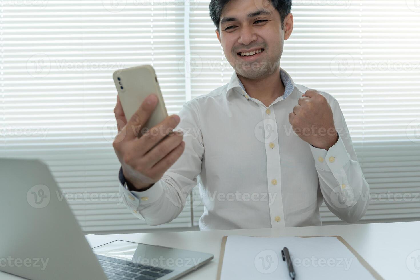 Asian handsome man exited surprise face expression . Male feels shocked with the phone. exciting smile and happy adorable rejoices. Very enjoy and fun relax time. wow, girl holding smartphone. photo