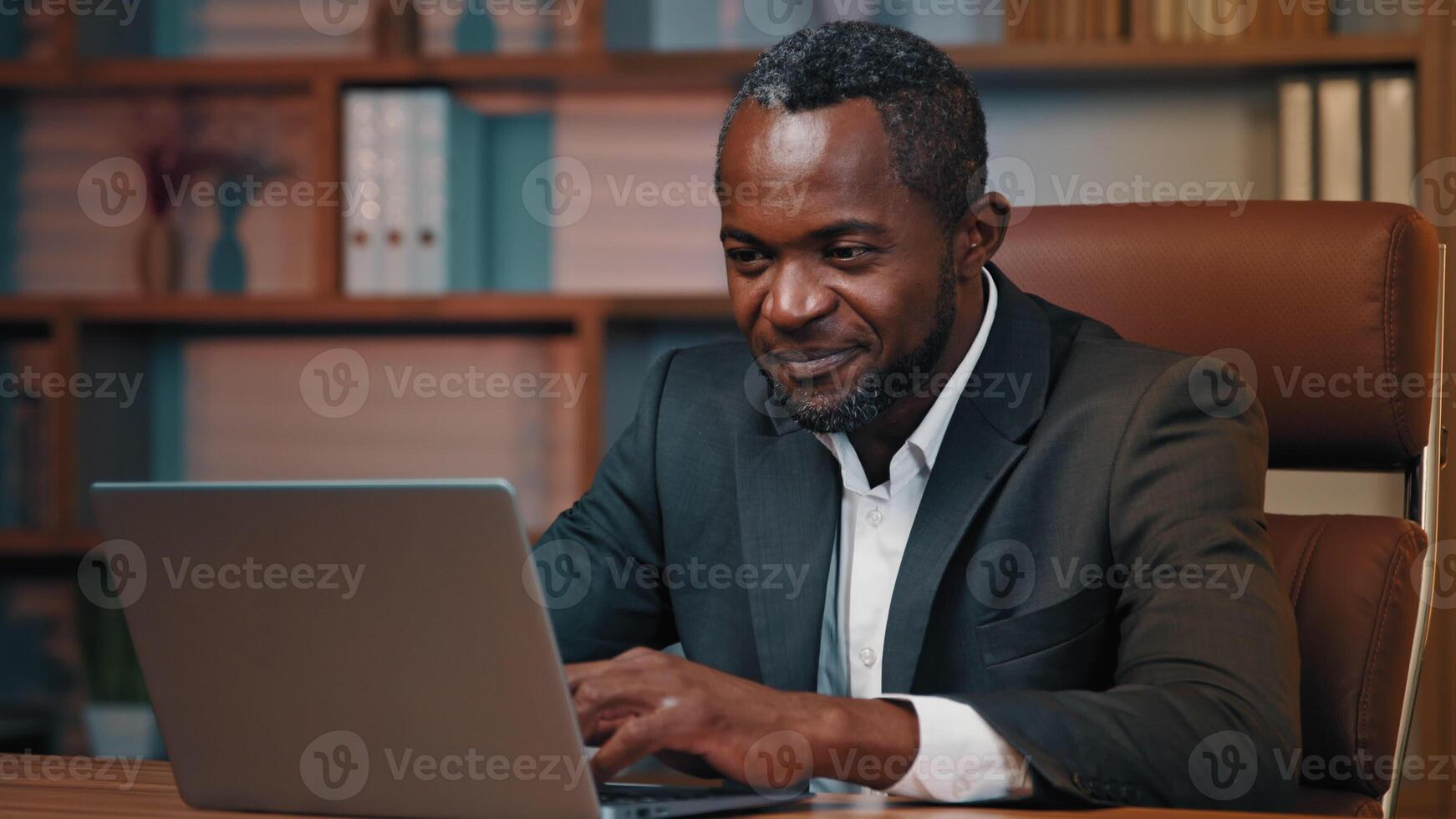 African american businessman check email read good news on laptop excited happy man leader rejoice in victory celebrating success get new opportunity great investment proposal achieve desired result photo