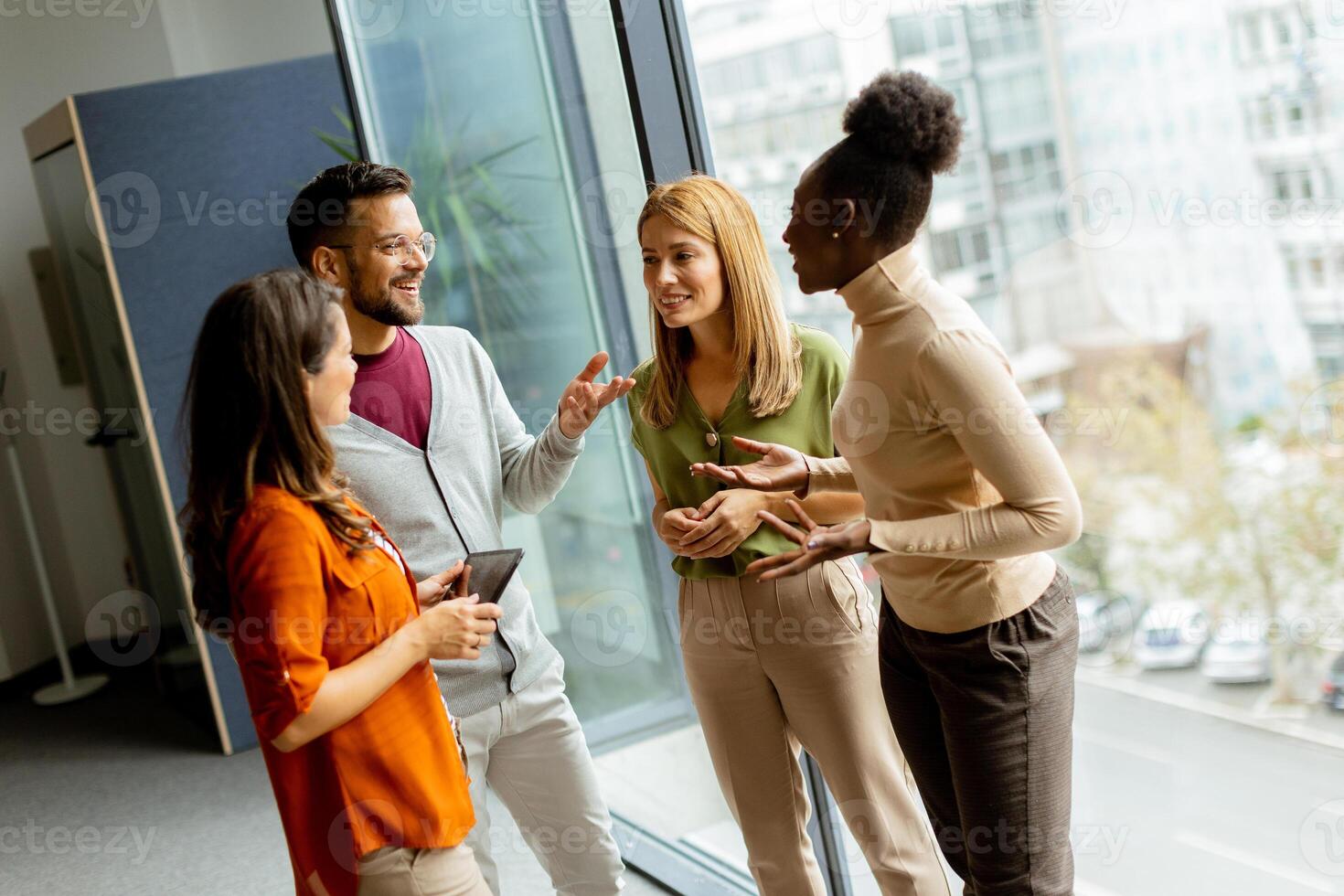 Young multiethnic startup team working in the modern office photo