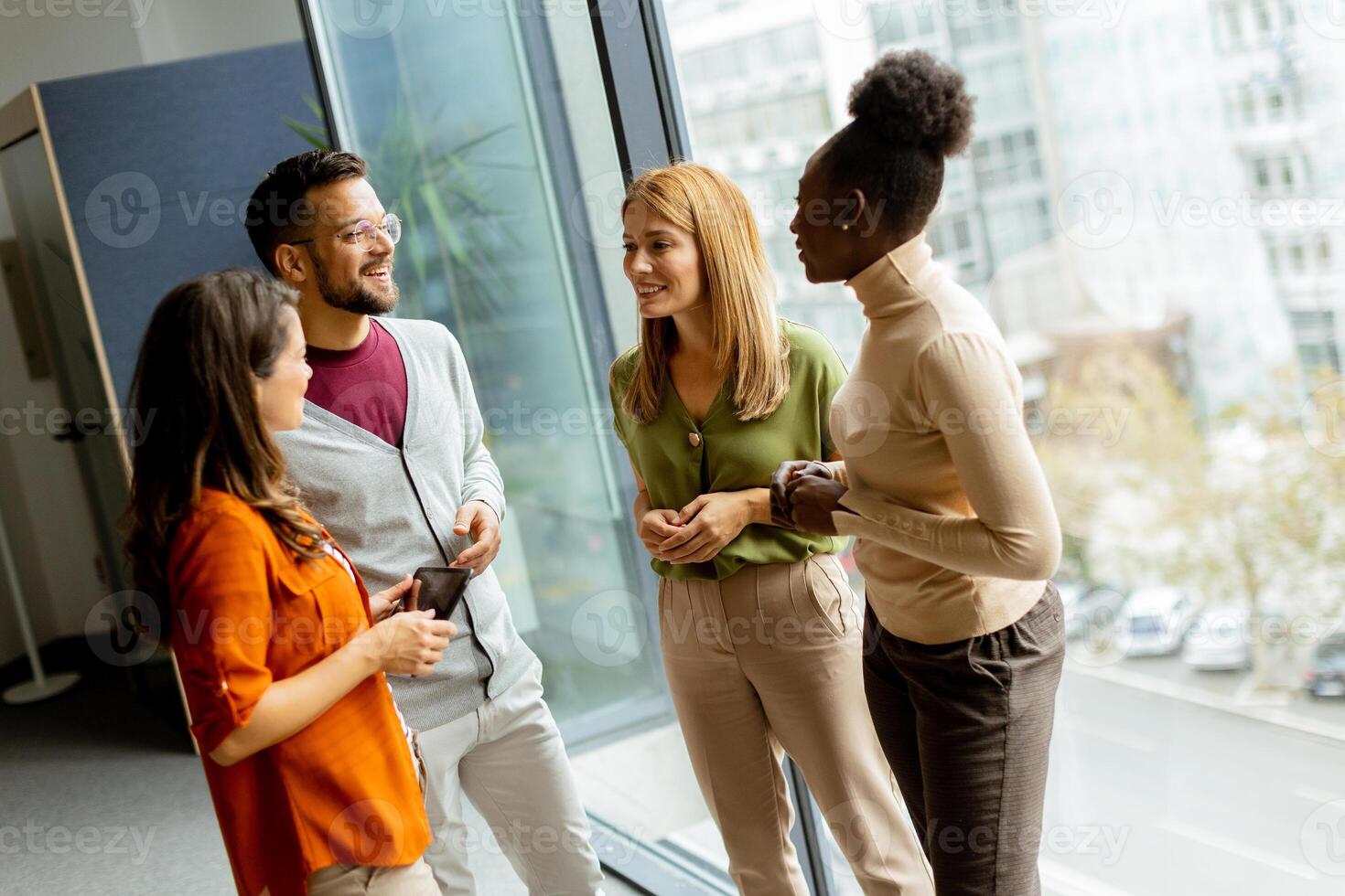 Young multiethnic startup team working in the modern office photo