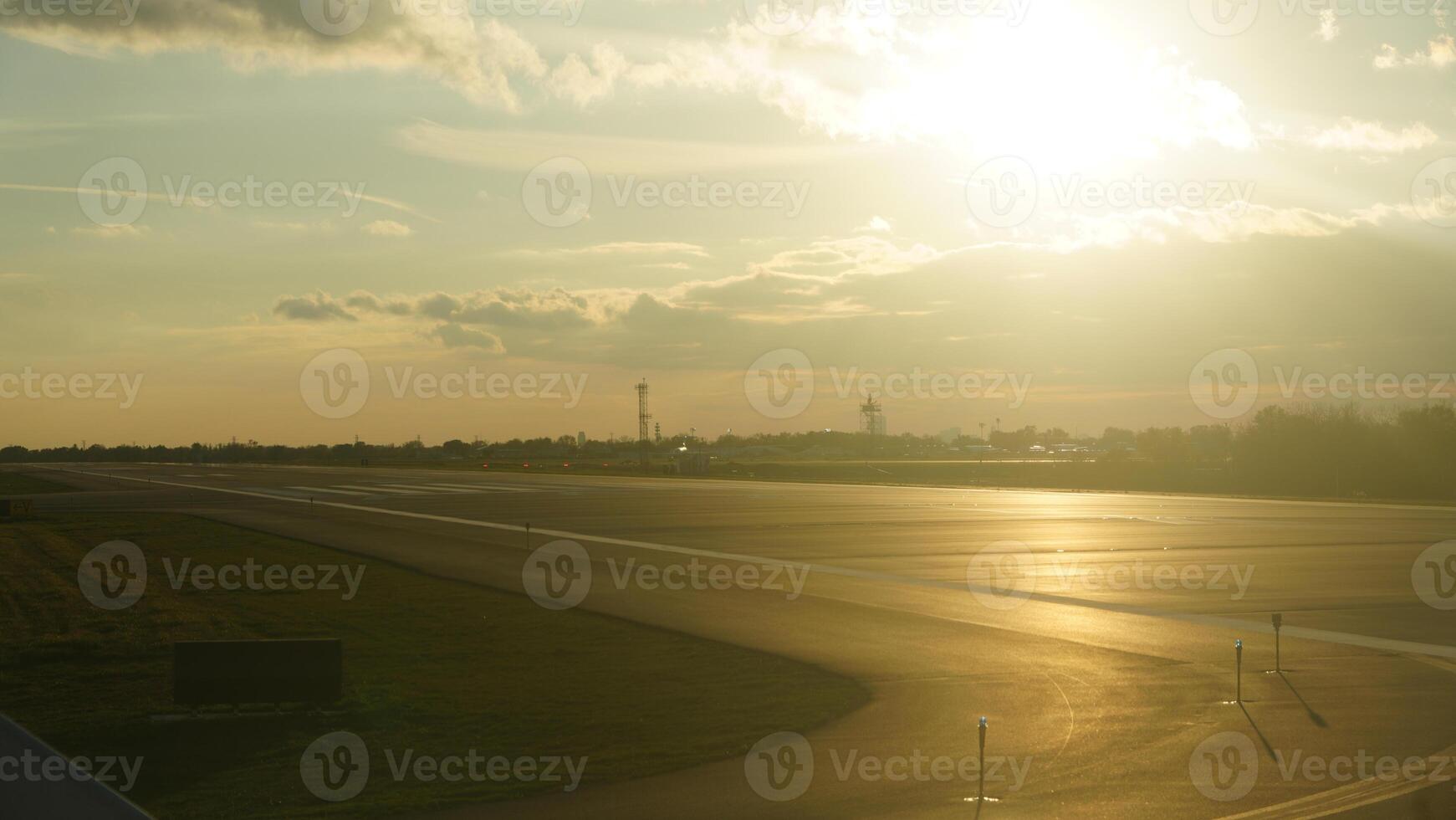 The airport view with the empty run way and sunset sunlight as background photo