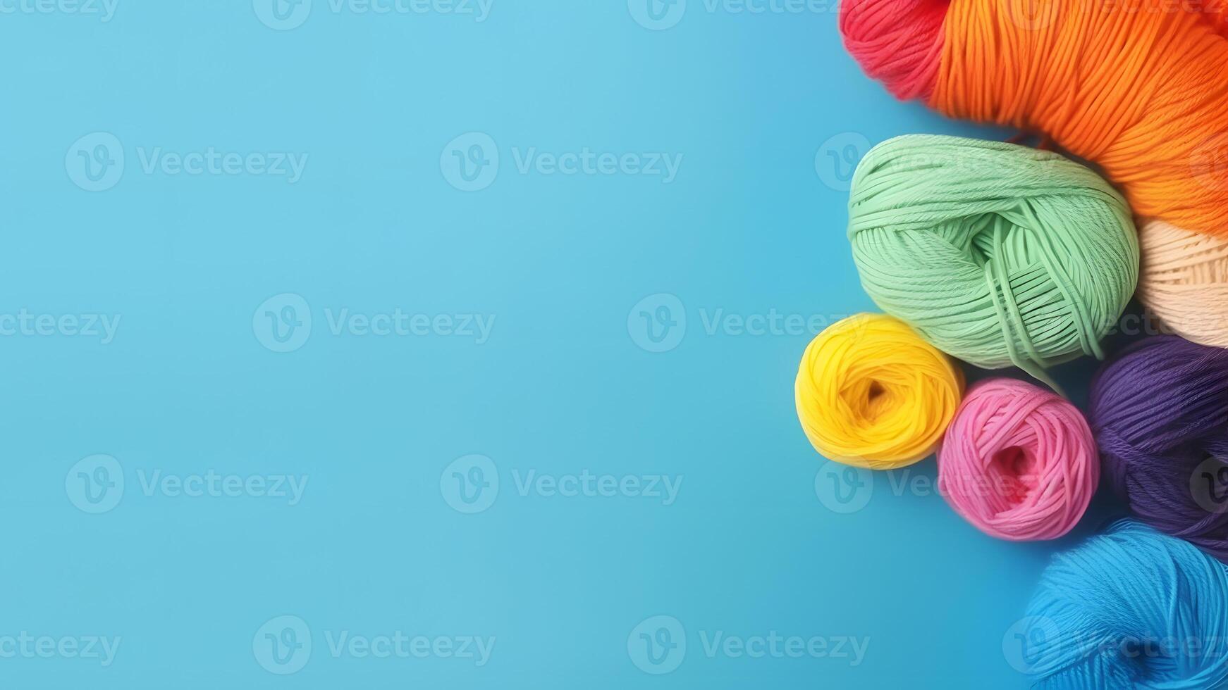 AI generated Knitting background with rainbow colorful yarn over blue background with copy space, neural network generated picture photo